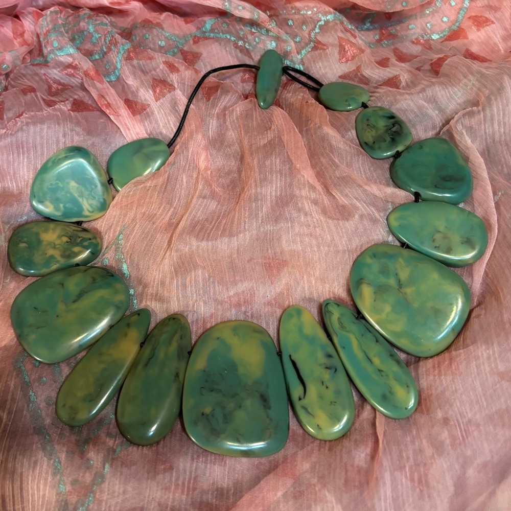 Runway village designer double sided swirl green yellow resin necklace.